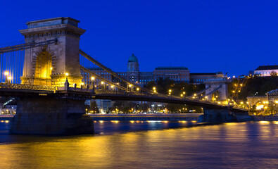 Image of Chain Bridge near Buda Fortress in evening illumination of Hungary outdoor.