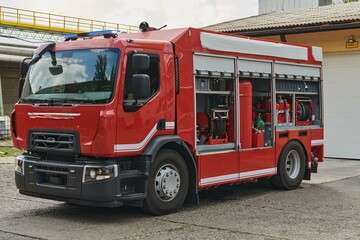 A state-of-the-art firetruck, equipped with advanced rescue technology, stands ready with its skilled firefighting team, prepared to intervene and respond rapidly to emergencies, ensuring the safety