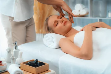 Foto op Canvas Caucasian woman enjoying relaxing anti-stress head massage and pampering facial beauty skin recreation leisure in dayspa modern light ambient at luxury resort or hotel spa salon. Quiescent © Summit Art Creations