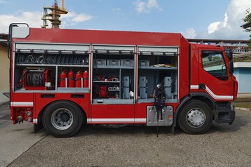 A state-of-the-art firetruck, equipped with advanced rescue technology, stands ready with its...