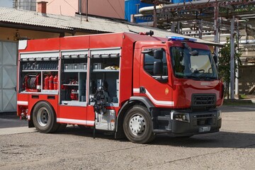 A state-of-the-art firetruck, equipped with advanced rescue technology, stands ready with its...