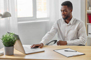 Obraz premium african man american computer freelancer online student workplace laptop education office job