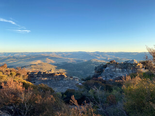 Spectacular views from a mountain-top lookout. Mountains in the horizon. Blue mountains, Australia. Grand canyon sunset. Unusual rock formation. Summit of the mountain.