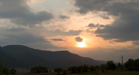 Sunset over the town of Sarnitsa, located in the Western Rhodope Mountains near the Dospat Reservoir.