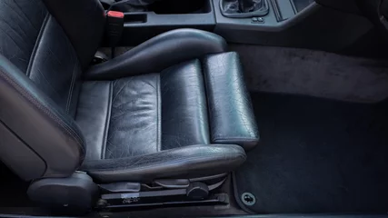 Fototapete Oldtimer Black leather passenger seat bottom