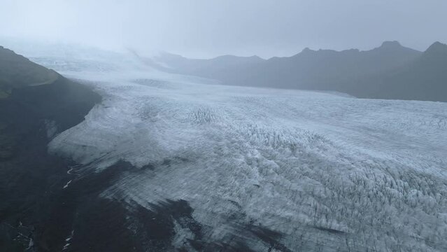 Vast glacier expanse under misty skies in Iceland
