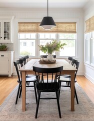 Black chairs and wood table in a bright dining room