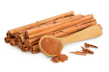 Cinnamon sticks with powder in wooden spoon isolated on white background with full depth of field