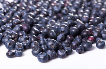 Closeup of fresh ripe blueberries on white background. Concept of healthy and diet food