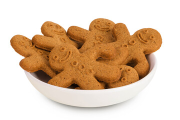 Gingerbread man in ceramic bowl isolated on white background