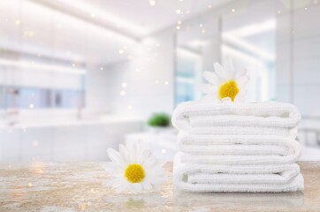 White towel on wooden table in modern bathroom