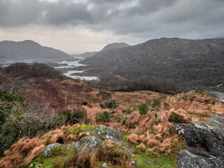 Wonderful nature scene with mountains and dark dramatic sky. Ladies view, Killarney, Ireland, ring of Kerry route. Magnificent Irish nature and popular travel and tourist area. Dark and moody look.
