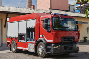 A state-of-the-art firetruck, equipped with advanced rescue technology, stands ready with its...