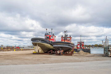 Tug Boats On Dry Land For Winter Storage
