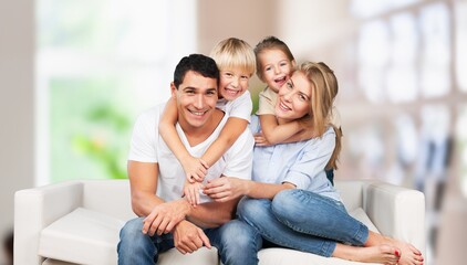 Fototapeta na wymiar Family portrait, happy parents and child at home