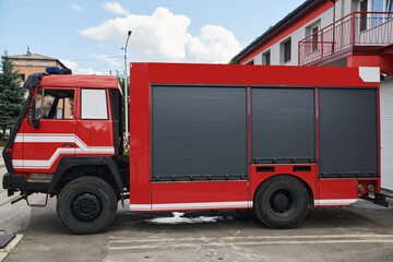 A state-of-the-art firetruck, equipped with advanced rescue technology, stands ready with its skilled firefighting team, prepared to intervene and respond rapidly to emergencies, ensuring the safety