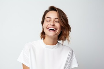 Portrait of a happy young woman laughing, isolated on white background - Powered by Adobe