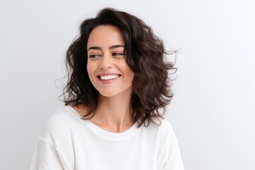 Portrait of a beautiful happy young woman smiling and looking at camera