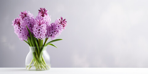 Spring hyacinths in a vase on a light background