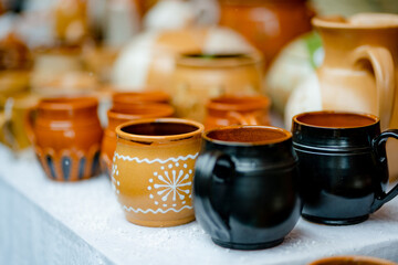 Ceramic dishes, tableware and jugs sold on Easter market in Vilnius. Lithuanian capital's annual traditional crafts fair is held on Old Town streets.