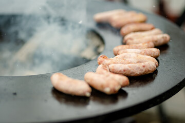 Traditional fried sausages being cooked at the spring market in Vilnius, Lithuania.