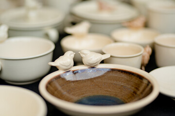 Ceramic dishes, tableware and jugs sold on Easter market in Vilnius. Lithuanian capital's annual traditional crafts fair is held on Old Town streets.