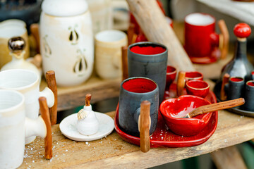 Ceramic dishes, tableware and jugs sold on Easter market in Vilnius. Lithuanian capital's annual traditional crafts fair is held on Old Town streets.