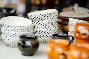 Ceramic dishes, tableware and jugs sold on Easter market in Vilnius. Lithuanian capital's annual traditional crafts fair is held on Old Town streets.