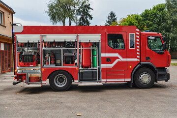 A state-of-the-art firetruck, equipped with advanced rescue technology, stands ready with its...