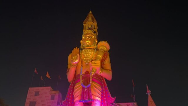 Night view of biggest golden statue of Lord Hanuman in front of temple at Rajarhat in Kolkata, India