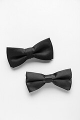 Black bow ties on white background