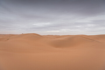 Dramatic sky over the never-ending sand dunes of Gobi desert in Inner Mongolia