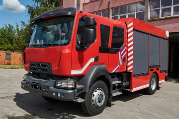A state-of-the-art firetruck, equipped with advanced rescue technology, stands ready with its skilled firefighting team, prepared to intervene and respond rapidly to emergencies, ensuring the safety