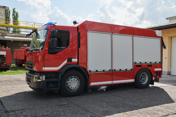 A state-of-the-art firetruck, equipped with advanced rescue technology, stands ready with its skilled firefighting team, prepared to intervene and respond rapidly to emergencies, ensuring the safety