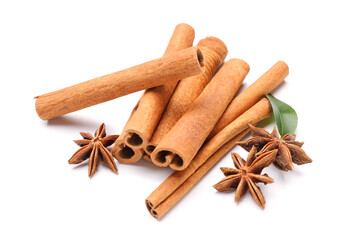 Cinnamon sticks with anise and leaf on white background