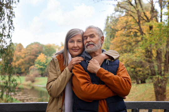 Portrait of affectionate senior couple in autumn park