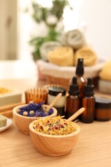 Dry flowers on wooden table indoors, space for text. Spa time