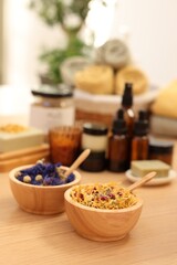 Dry flowers on wooden table indoors, space for text. Spa time