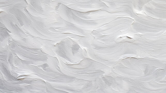 Close-up of uneven and rough white paint surface texture painted on gray cement wall. Rough textured background of gesso and acrylic paint.