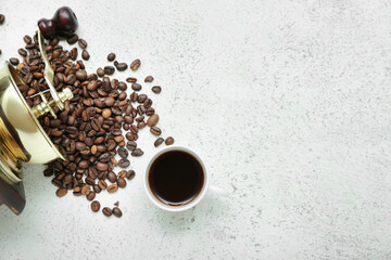Cup of hot espresso with beans on light background