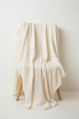 Fototapeta premium A cotton blanket on a minimalist white background AI generated