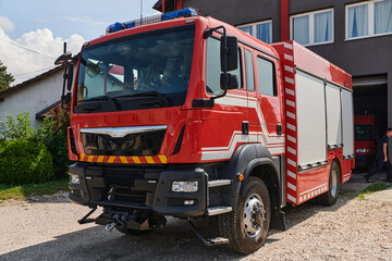 Fototapeta na wymiar A state-of-the-art firetruck, equipped with advanced rescue technology, stands ready with its skilled firefighting team, prepared to intervene and respond rapidly to emergencies, ensuring the safety