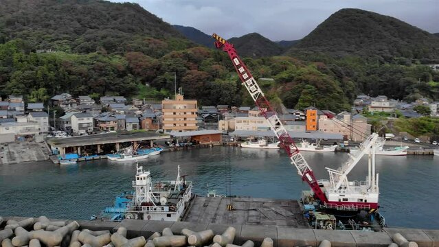 Aerial footage over Japanese Fishing town port- Aerial
Drone view over Japanese Fishing town pier, Echizen, Japan
