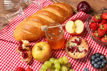 Composition with tasty food for picnic on wooden background