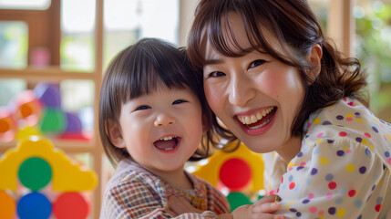 Fototapeta na wymiar 日本の幼稚園児と先生/親子がカラフルなおもちゃで笑顔で遊んでいる写真、背景保育ルーム、木育/幼児教育