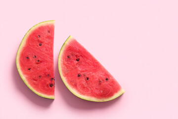 Pieces of fresh watermelon on pink background