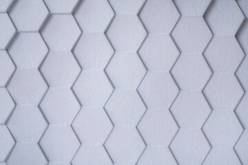 Geometric shapes in the form of a hexagon on a white polyurethane surface. Abstract unusual...
