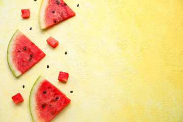 Composition with different pieces of ripe watermelon on yellow background