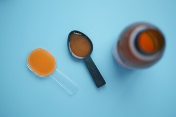 cough syrup on a plastic spoon 