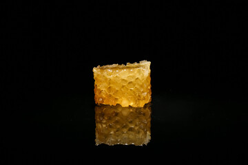 Sweet honeycomb on black background